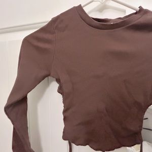 Dark brown cropped long sleeve with string ties on the back
